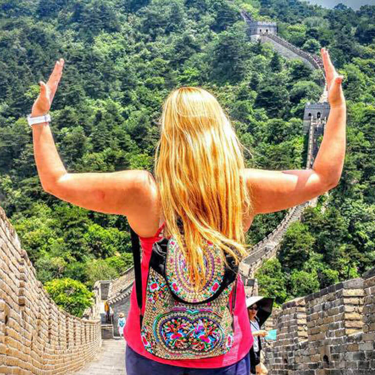 Student in Capstone on the Great Wall of China