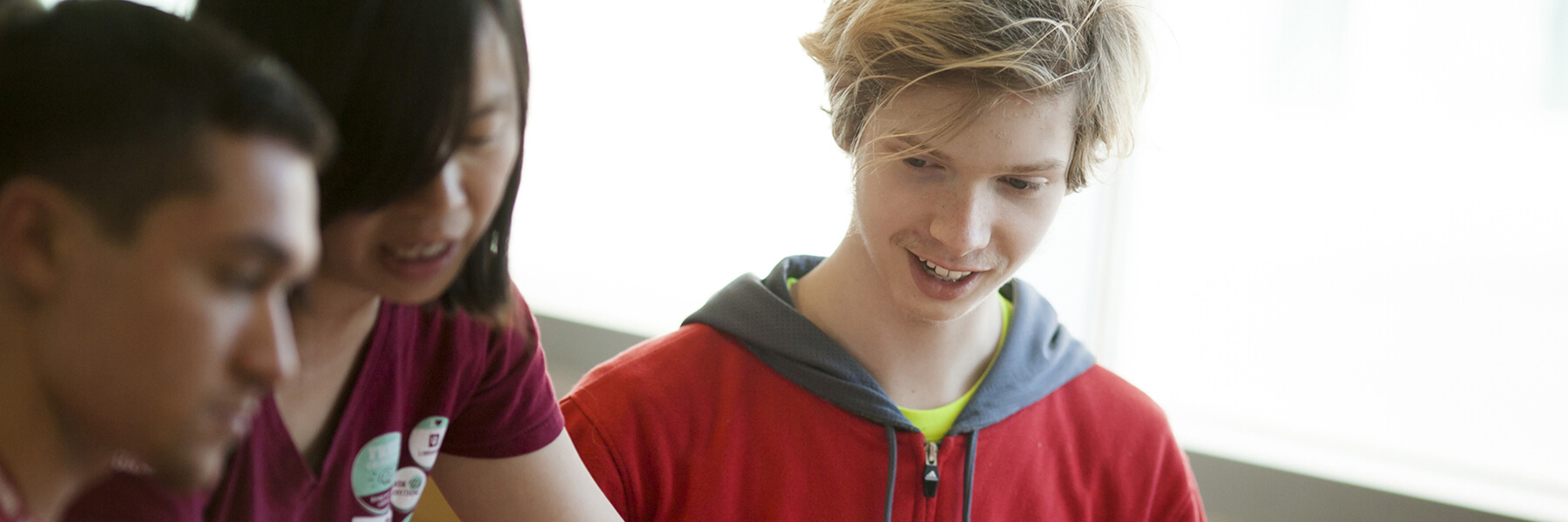 A person tutoring a group of students
