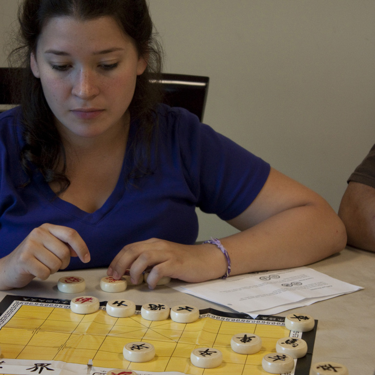 Student learning Chinese board game